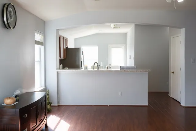 a living room with a table and a window