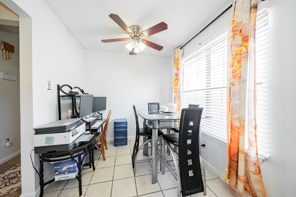 1524 Crowell Road Kaufman, TX 75142 - Photo 18 of 28 a view of a dining room with furniture and a window