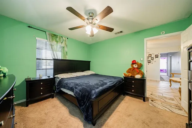 a bedroom with a bed and window