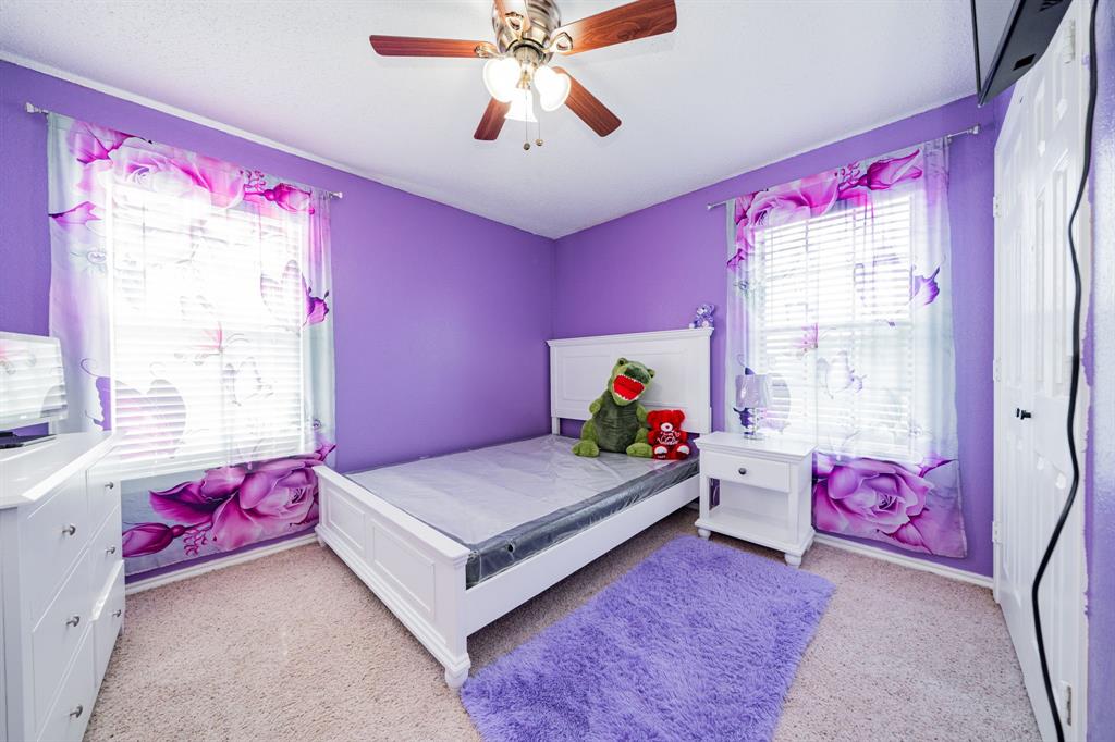 1524 Crowell Road Kaufman, TX 75142 - Photo 23 of 28 a bedroom with pink walls a bed and a window