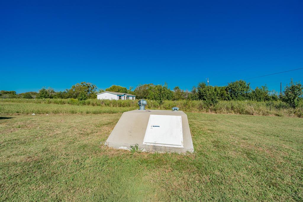 1524 Crowell Road Kaufman, TX 75142 - Photo 26 of 28 a view of a field with an trees