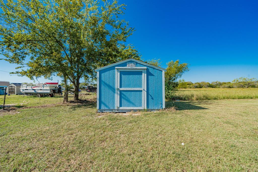 1524 Crowell Road Kaufman, TX 75142 - Photo 27 of 28 a view of a house with a yard