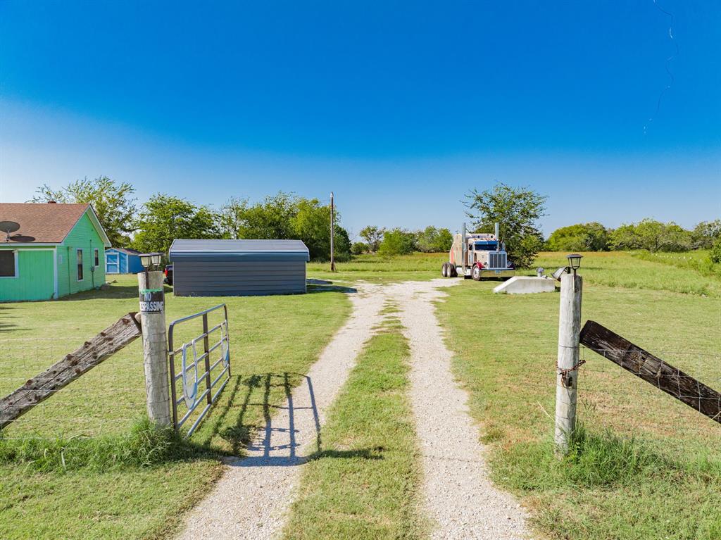 1524 Crowell Road Kaufman, TX 75142 - Photo 8 of 28 a view of a swimming pool with a patio