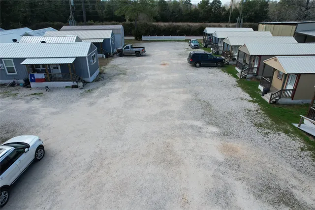 a view of backyard with sitting area