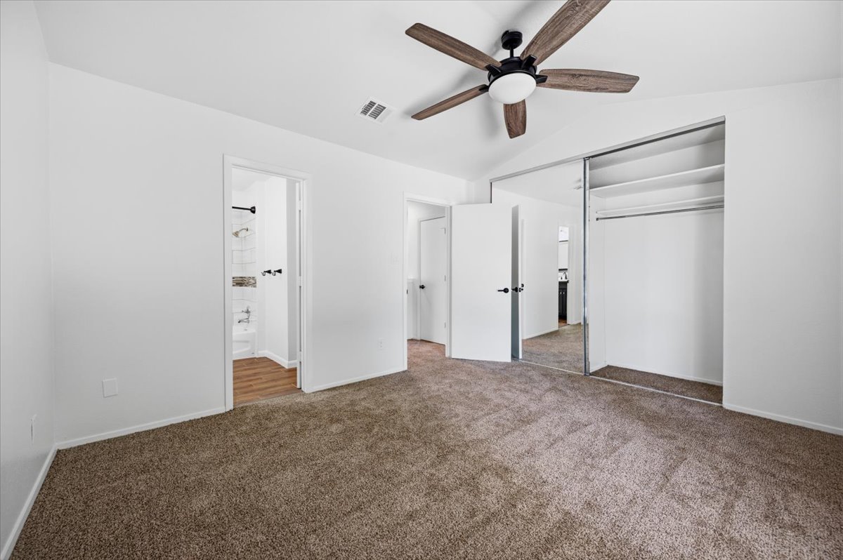 41 Abbey Road Euless, TX 76039 - Photo 17 of 23 Plush carpeting and closet with sliding mirrored doors define this peaceful space.