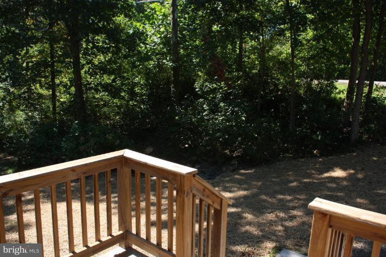 12908 Rousby Hall Road Lusby, MD 20657 - Photo 10 of 15 Front deck overlooking front Lawn