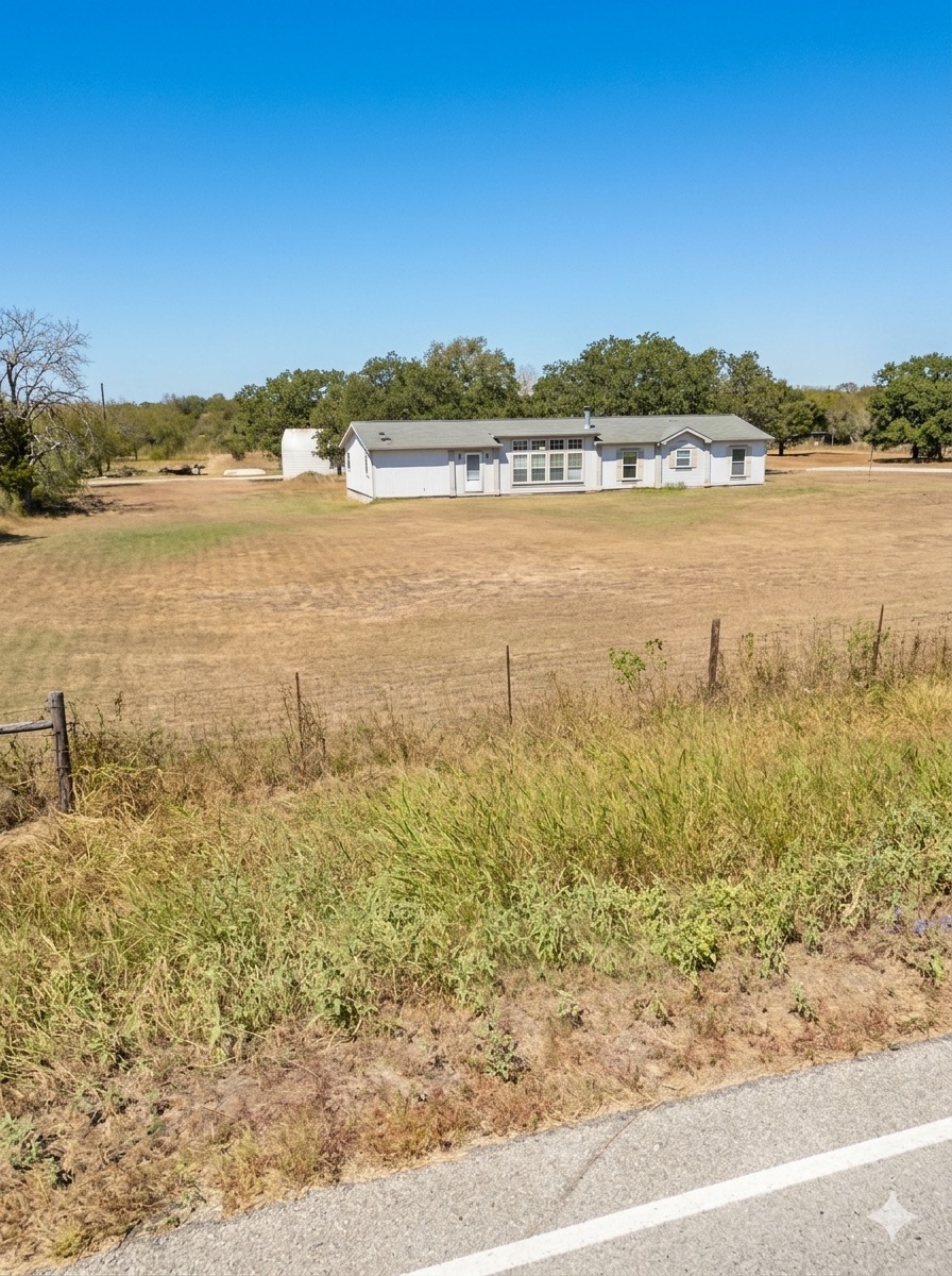 19925 Blake Manor Road Manor, TX 78653 - Photo 6 of 14 View of yard with a view of countryside
