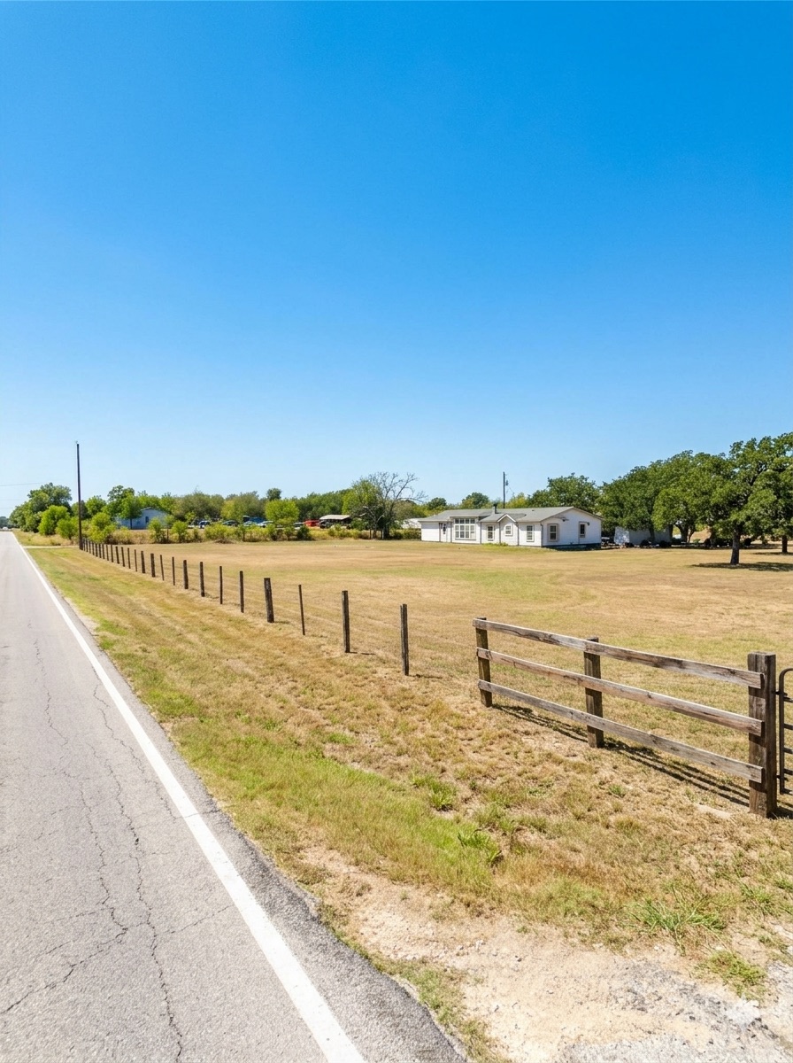 19925 Blake Manor Road Manor, TX 78653 - Photo 8 of 14 View of asphalt road with a view of rural / pastoral area