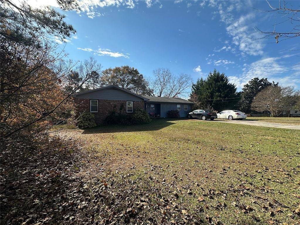 2170 Beaver Shop Road Marietta, GA 30066 - Photo 2 of 6 a view of a house with a yard