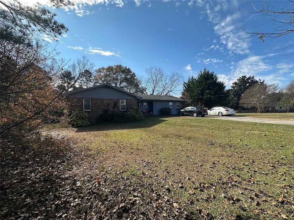 2170 Beaver Shop Road Marietta, GA 30066 - Photo 4 of 6 a view of a house with a yard