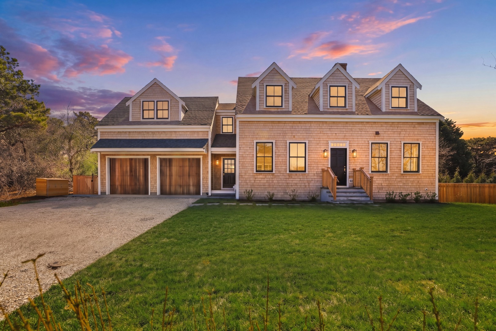 10 Rudder Lane Nantucket, MA 02554 - Photo 1 of 33 a front view of a house with a garden and deck