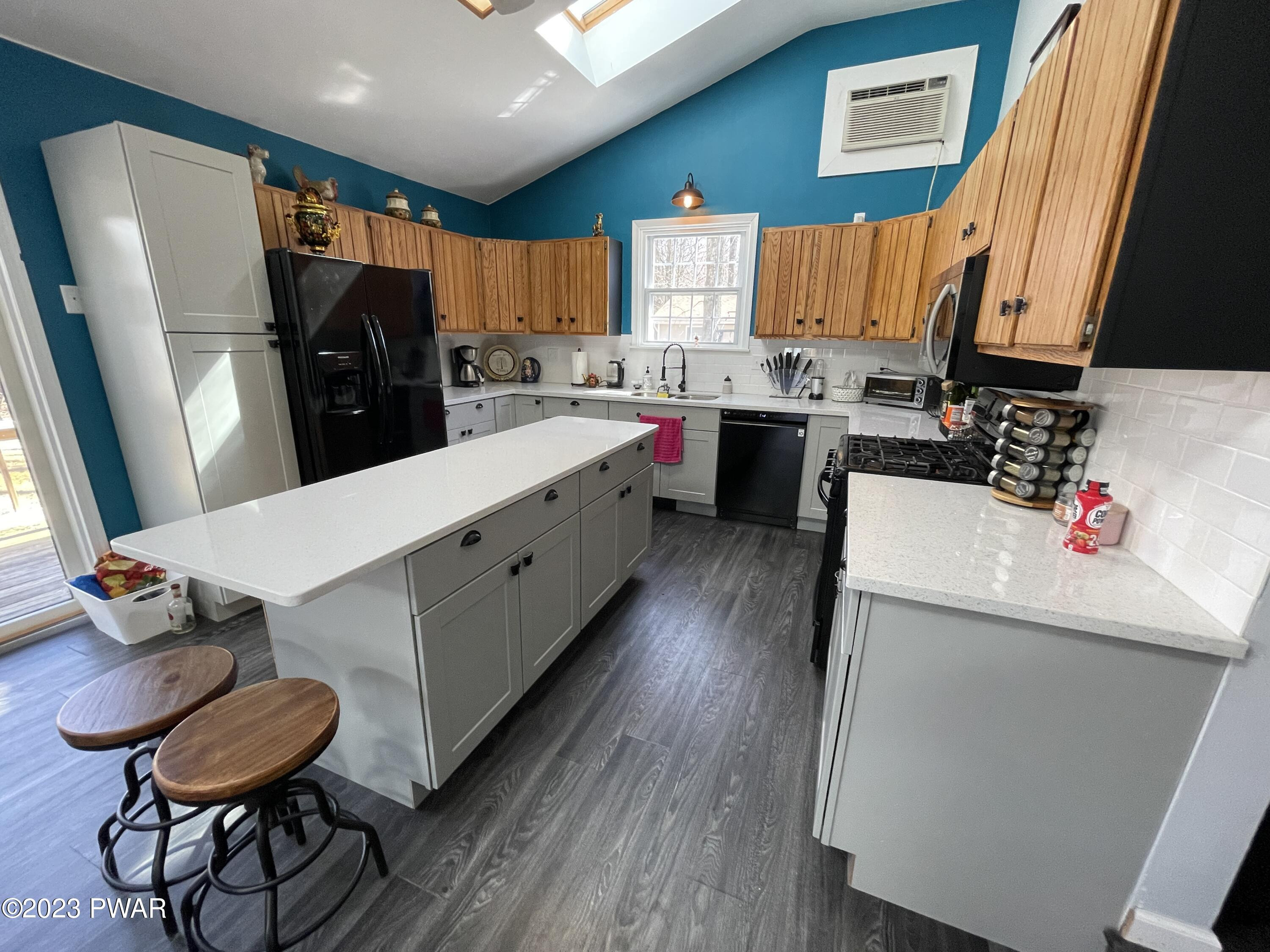 146 Roundhill Road Dingmans Ferry, PA 18328 - Photo 13 of 53 a kitchen with a sink appliances and cabinets