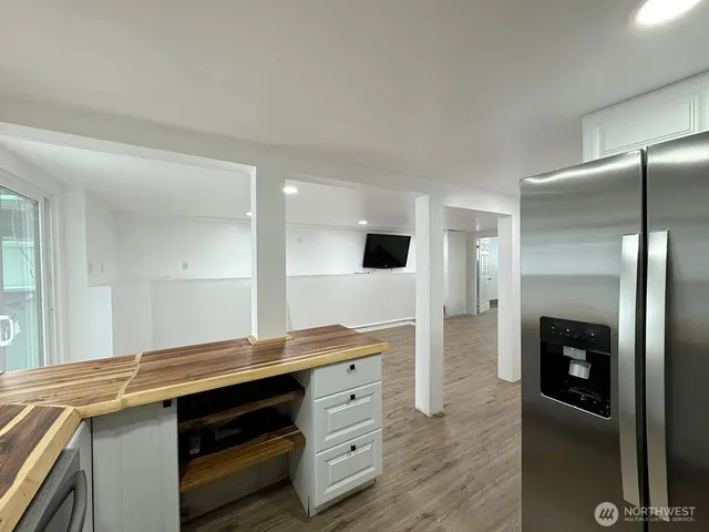 a kitchen with cabinets and stainless steel appliances