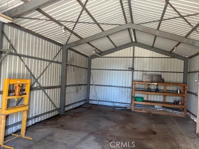a view of a garage with wooden wall