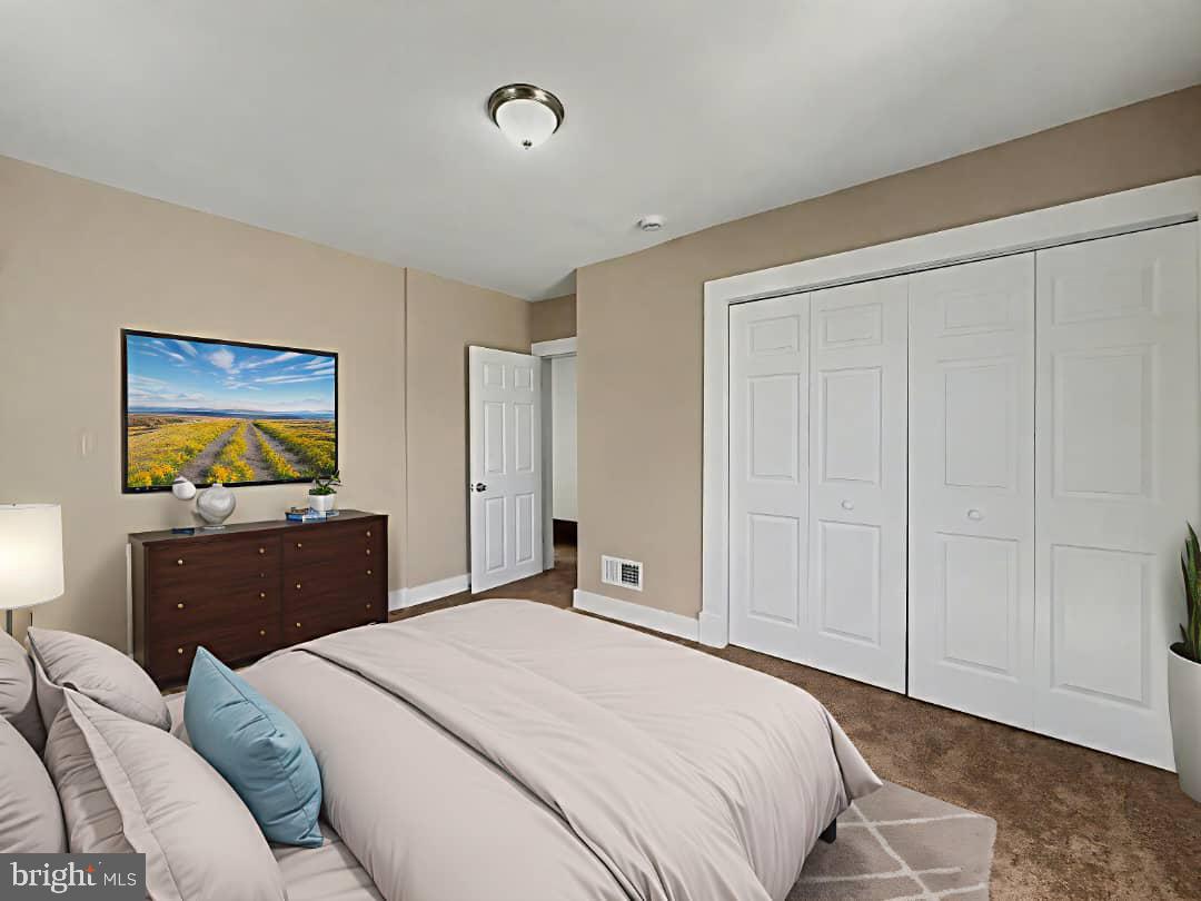 5505 Tramore Road Baltimore, MD 21214 - Photo 11 of 28 a bedroom with a bed and a cabinet