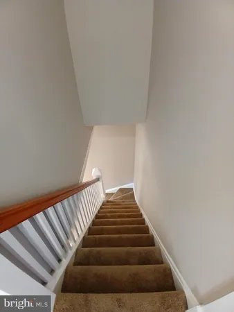 a view of a porch with wooden floor and fence