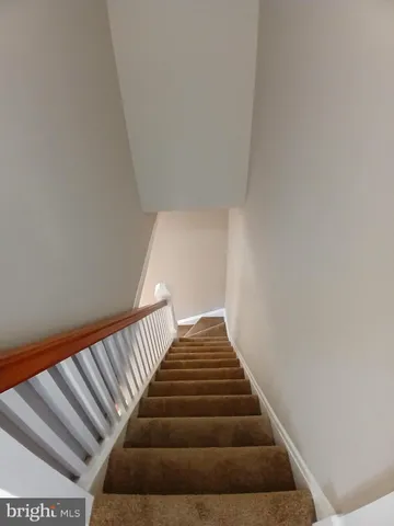 a view of a porch with wooden floor and fence