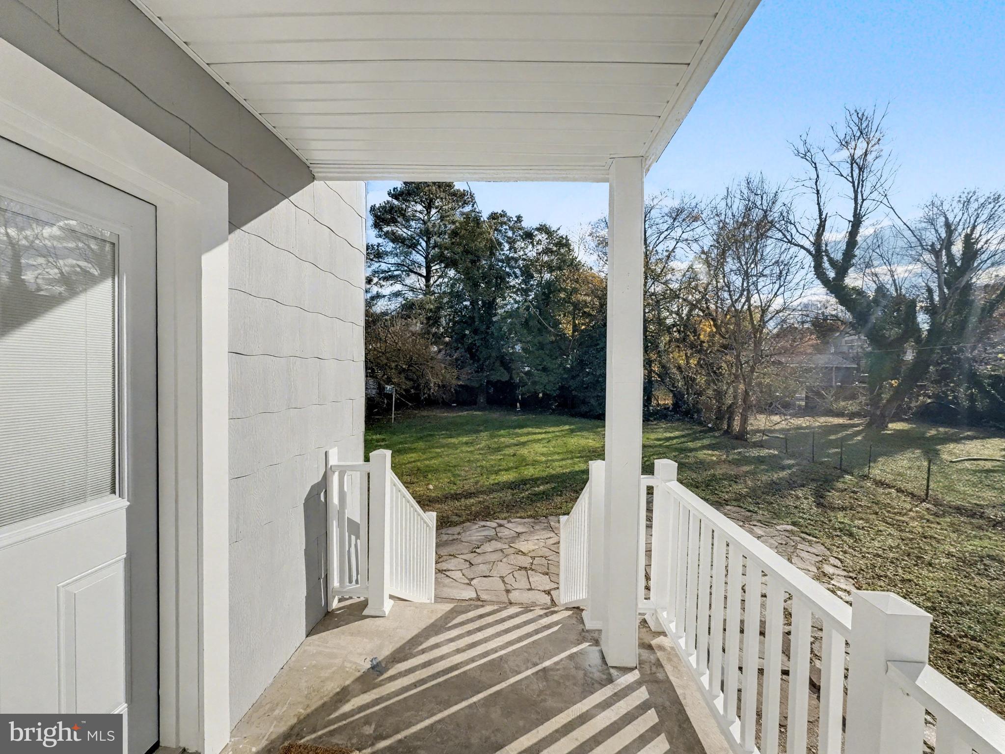 5505 Tramore Road Baltimore, MD 21214 - Photo 18 of 28 a view of a porch with wooden floor and fence
