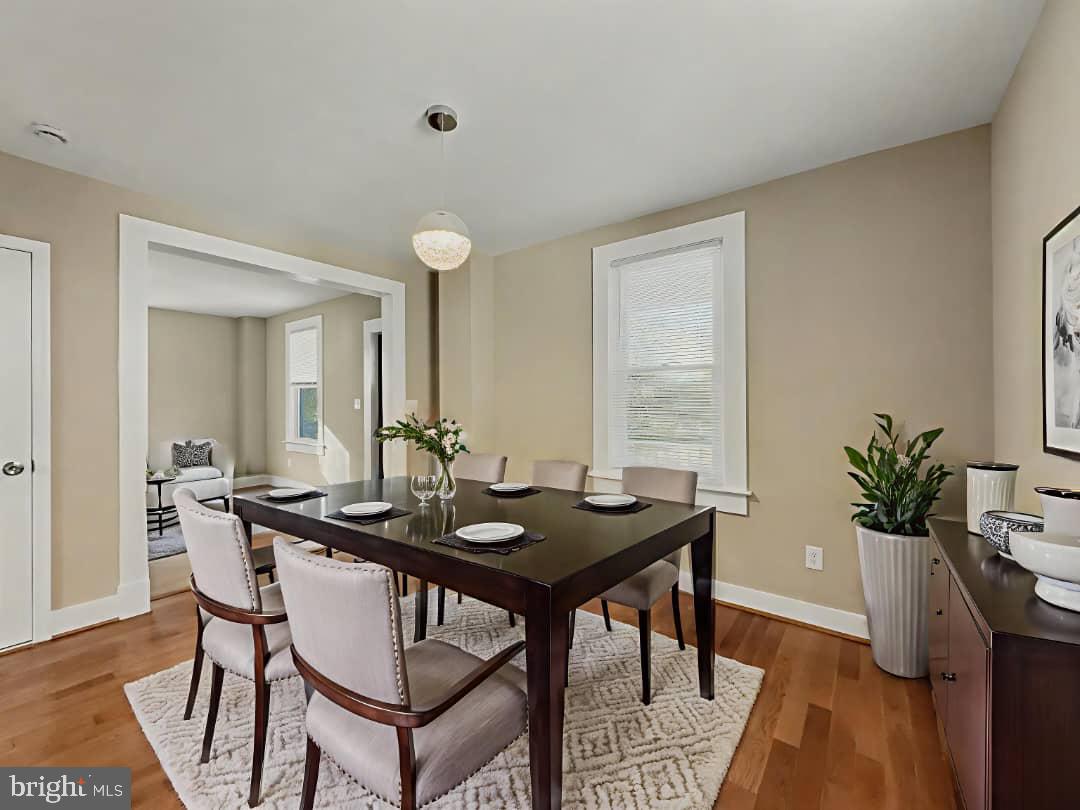 5505 Tramore Road Baltimore, MD 21214 - Photo 4 of 28 a view of a dining room with furniture and wooden floor