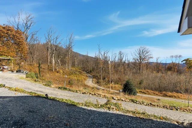 a view of mountain with lake view