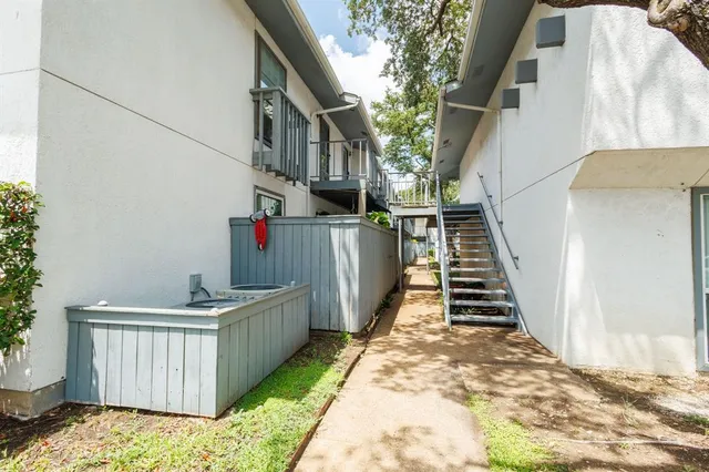 a stairs and yard with wooden fence