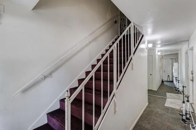 a view of staircase with wooden floor and stairs