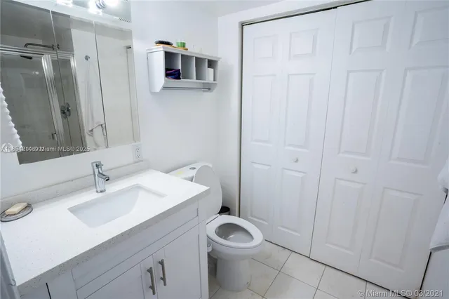 a bathroom with a glass shower door