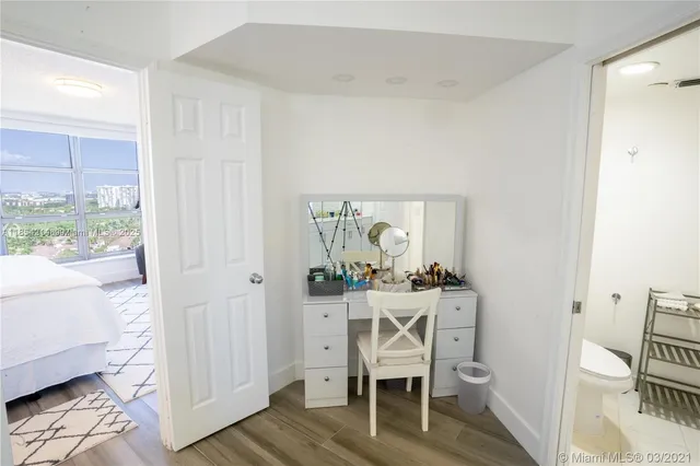 a white toilet sitting next to a sink