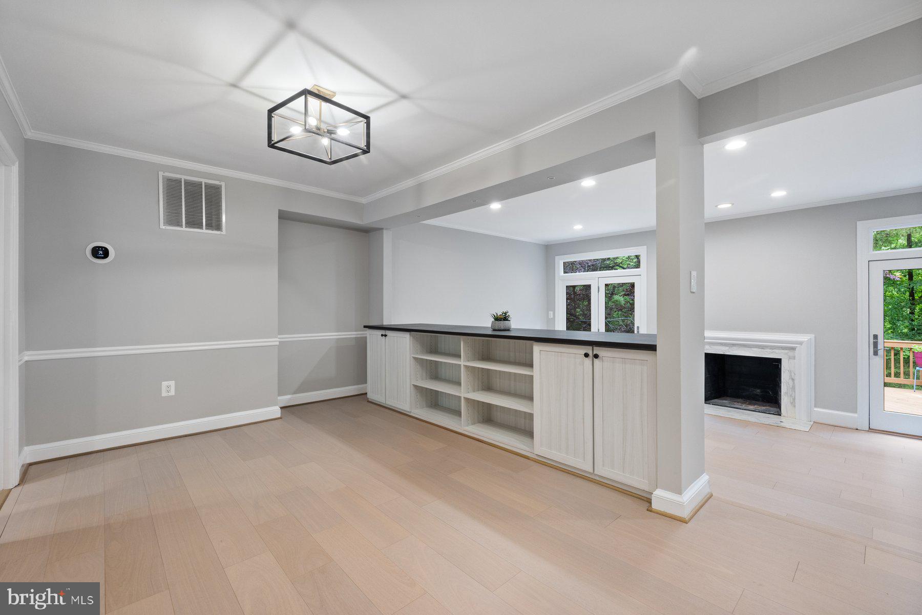 7322 Greentree Road Bethesda, MD 20817 - Photo 11 of 53 an empty room with windows and fireplace