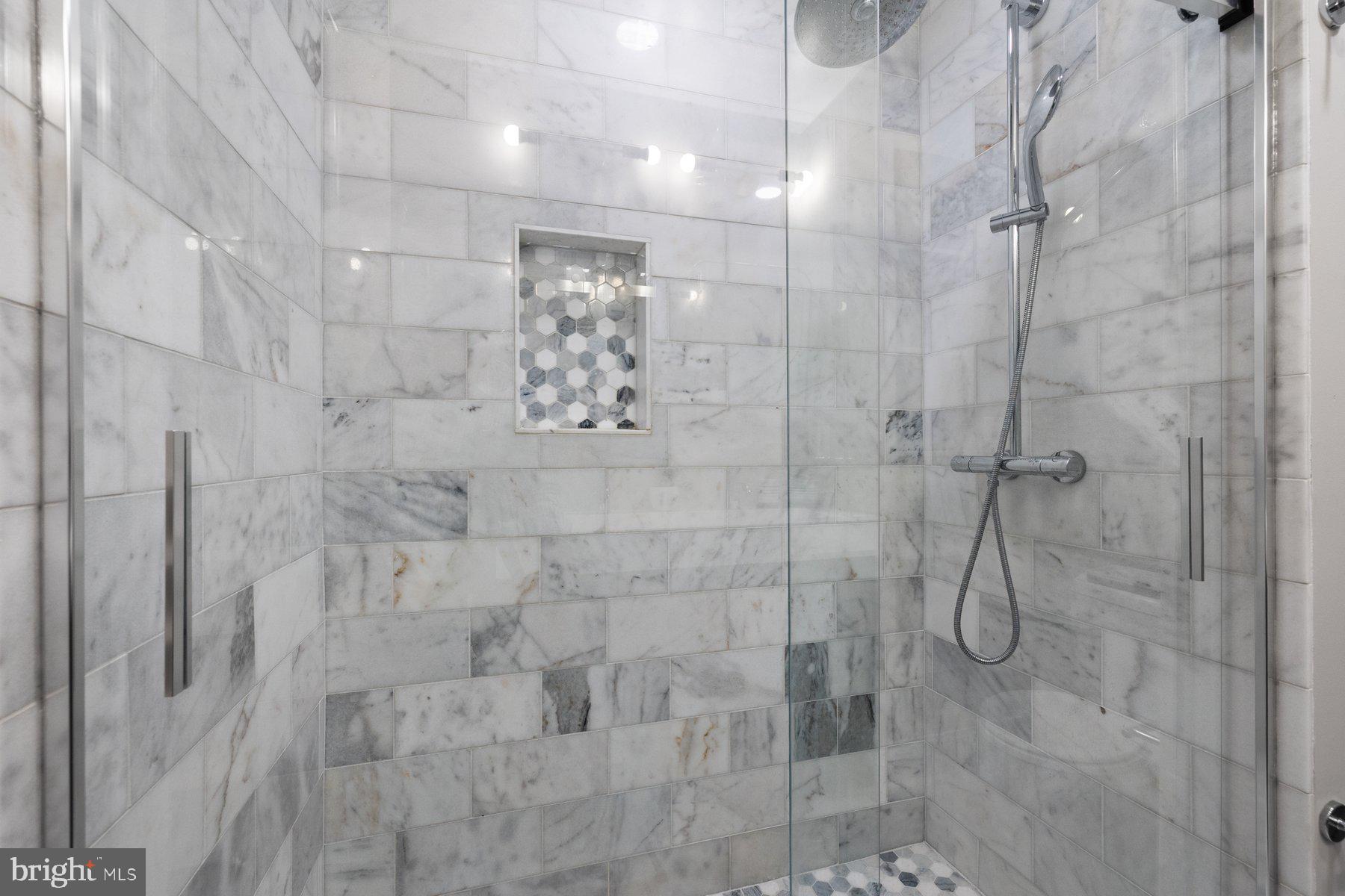 7322 Greentree Road Bethesda, MD 20817 - Photo 27 of 53 a bathroom with a shower