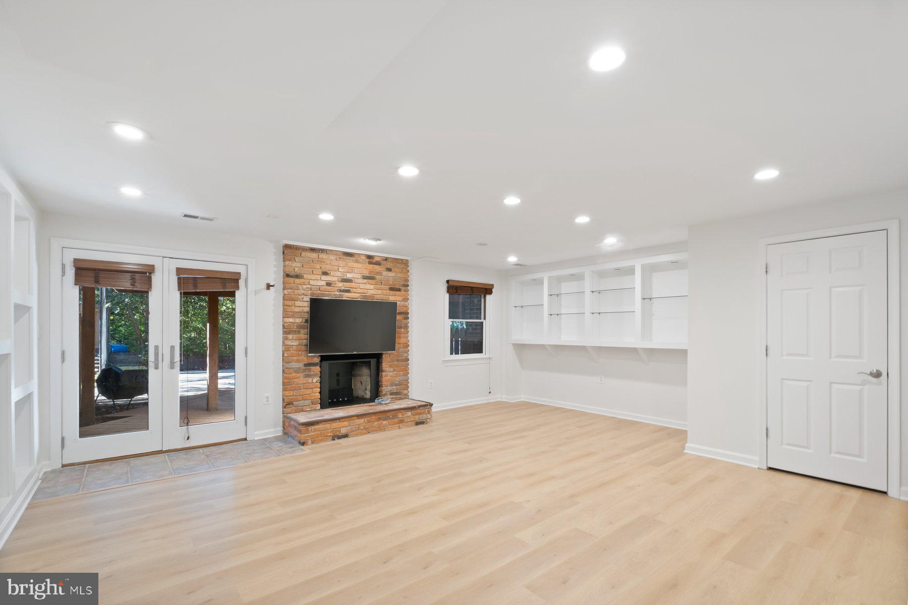 7322 Greentree Road Bethesda, MD 20817 - Photo 43 of 53 a view of an empty room with wooden floor and a window