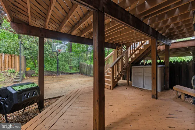 a view of a backyard with wooden floor and roof with a roof