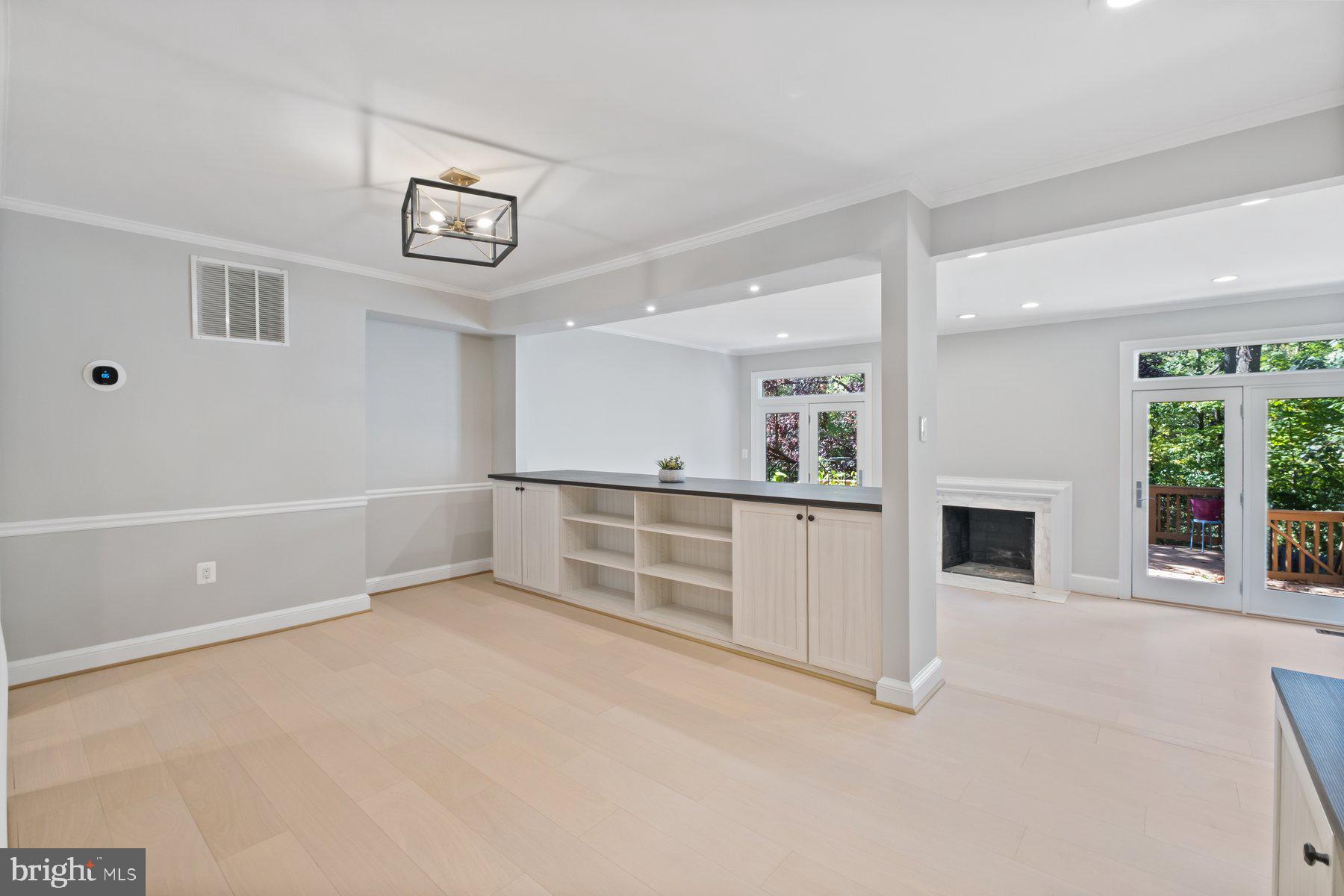 7322 Greentree Road Bethesda, MD 20817 - Photo 6 of 53 an empty room with windows and fireplace