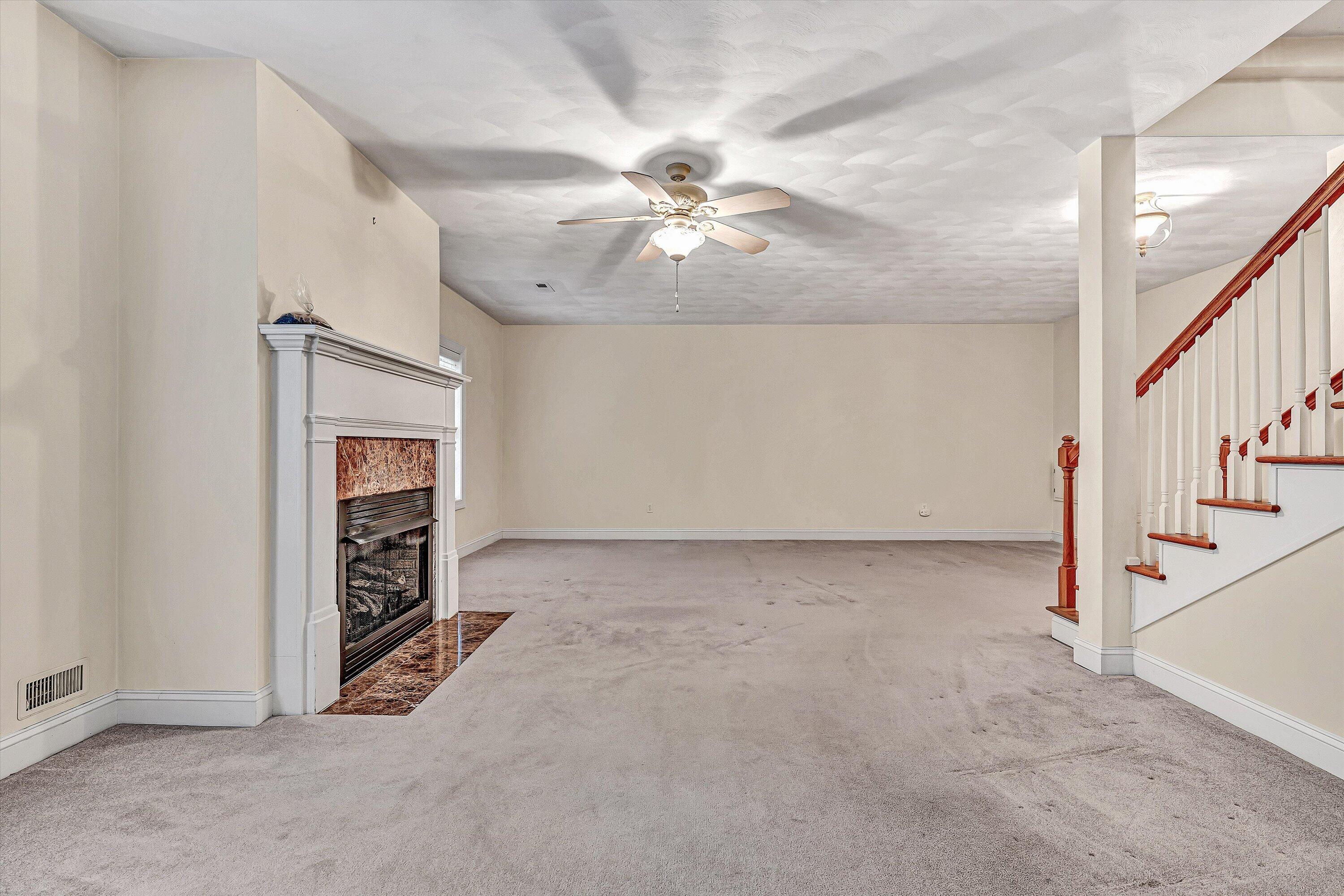 131 Stoney Mill Road Rocky Mount, VA 24151 - Photo 24 of 37 a view of an empty room with a ceiling fan