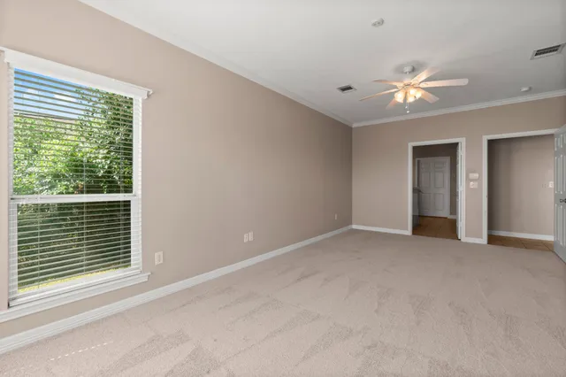 a view of empty room with window and fireplace
