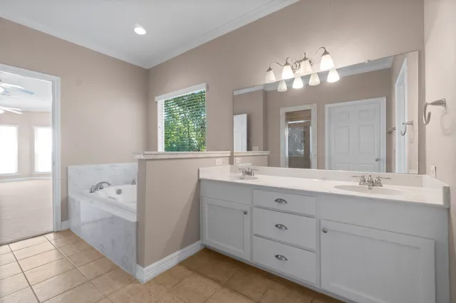 a view of a bathroom from a hallway