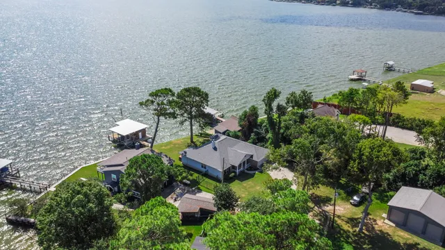 a flower garden with lots of plants in pots