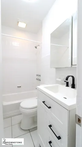 a bathroom with a sink a toilet and a bathtub