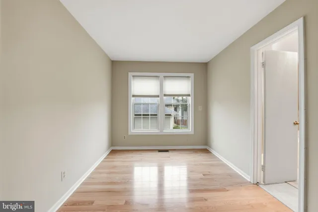 a view of a room with wooden floor