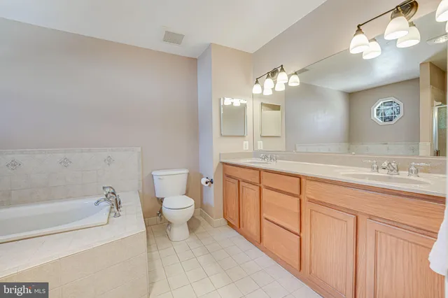 a bathroom with a sink a shower and mirror