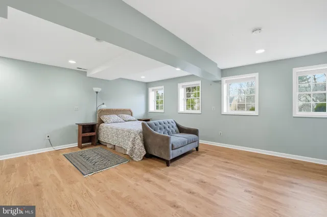 a bedroom with furniture and window