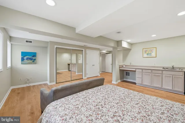 a spacious bathroom with a sink a toilet a shower and a mirror