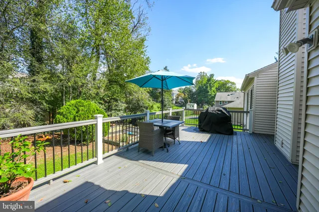 a view of swimming pool with a garden and trees