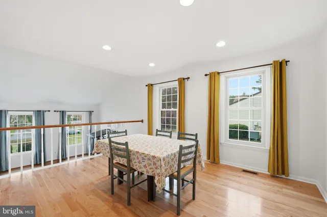 a view of a dining room with furniture and window