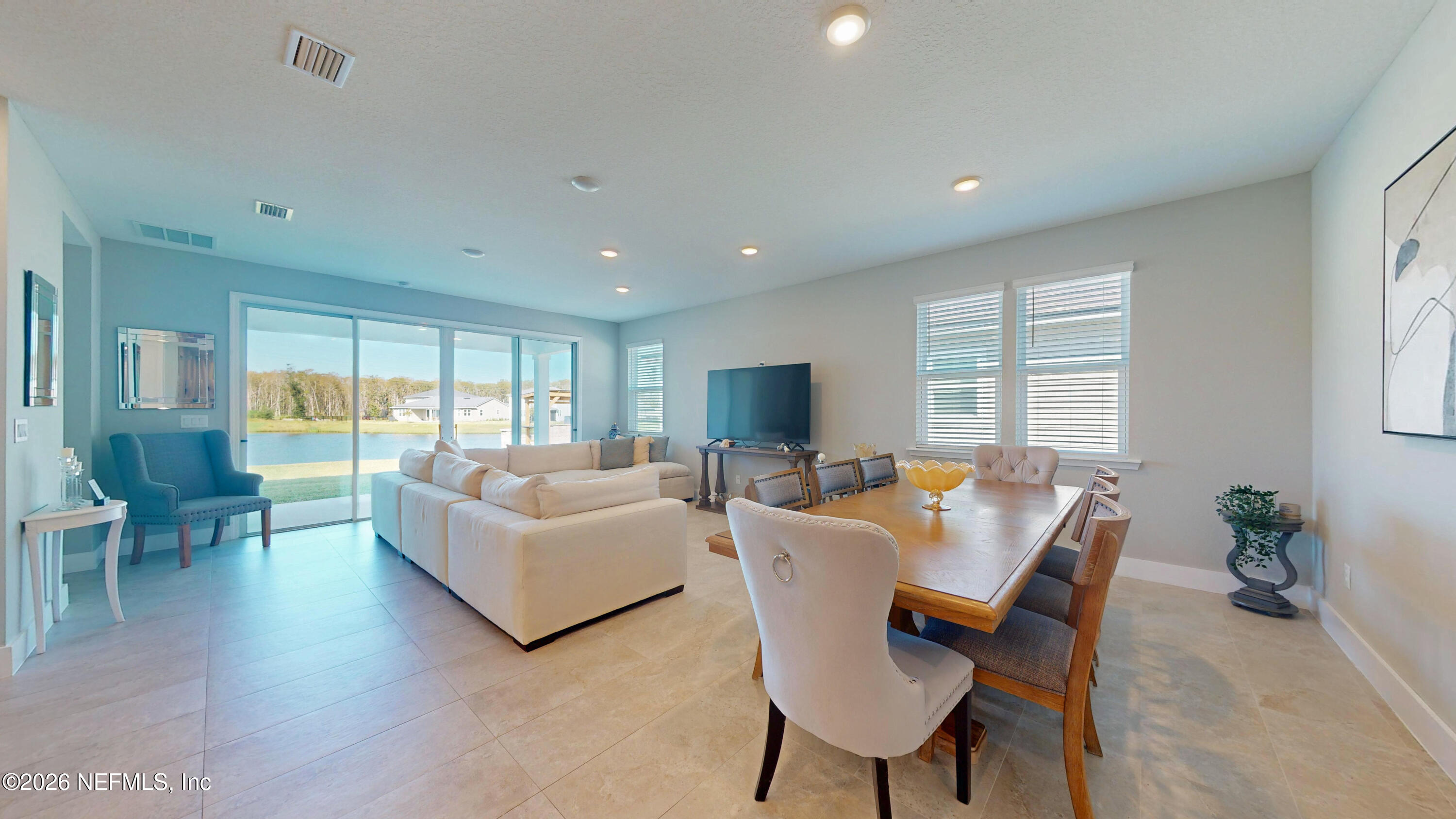 122 Field Flower Way St. Augustine, FL 32092 - Photo 25 of 55 a living room with fireplace furniture and a large window