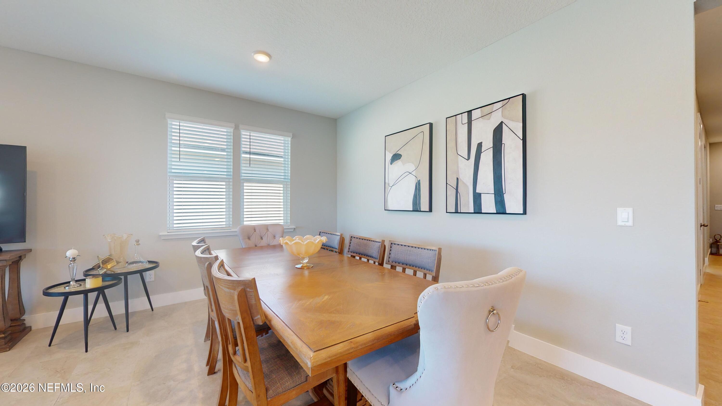 122 Field Flower Way St. Augustine, FL 32092 - Photo 27 of 55 a view of a a dining room with furniture window and wooden floor