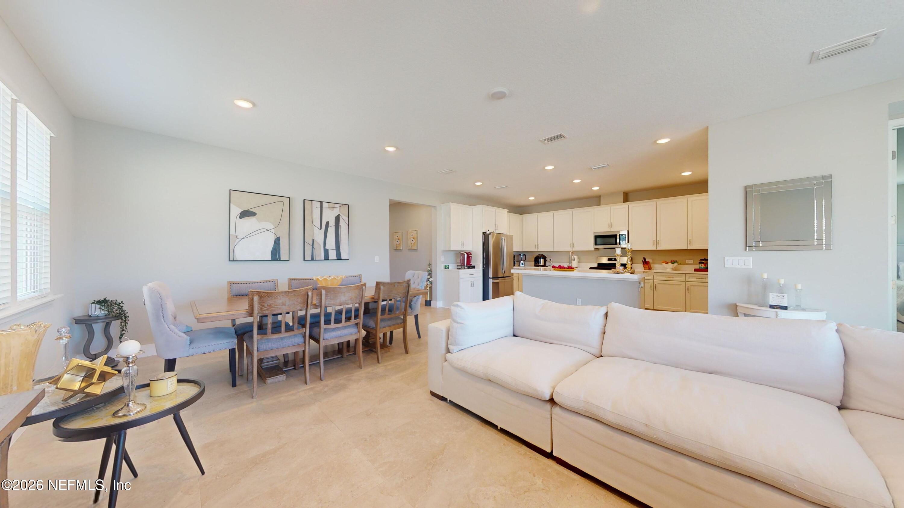 122 Field Flower Way St. Augustine, FL 32092 - Photo 31 of 55 a living room with furniture and kitchen view