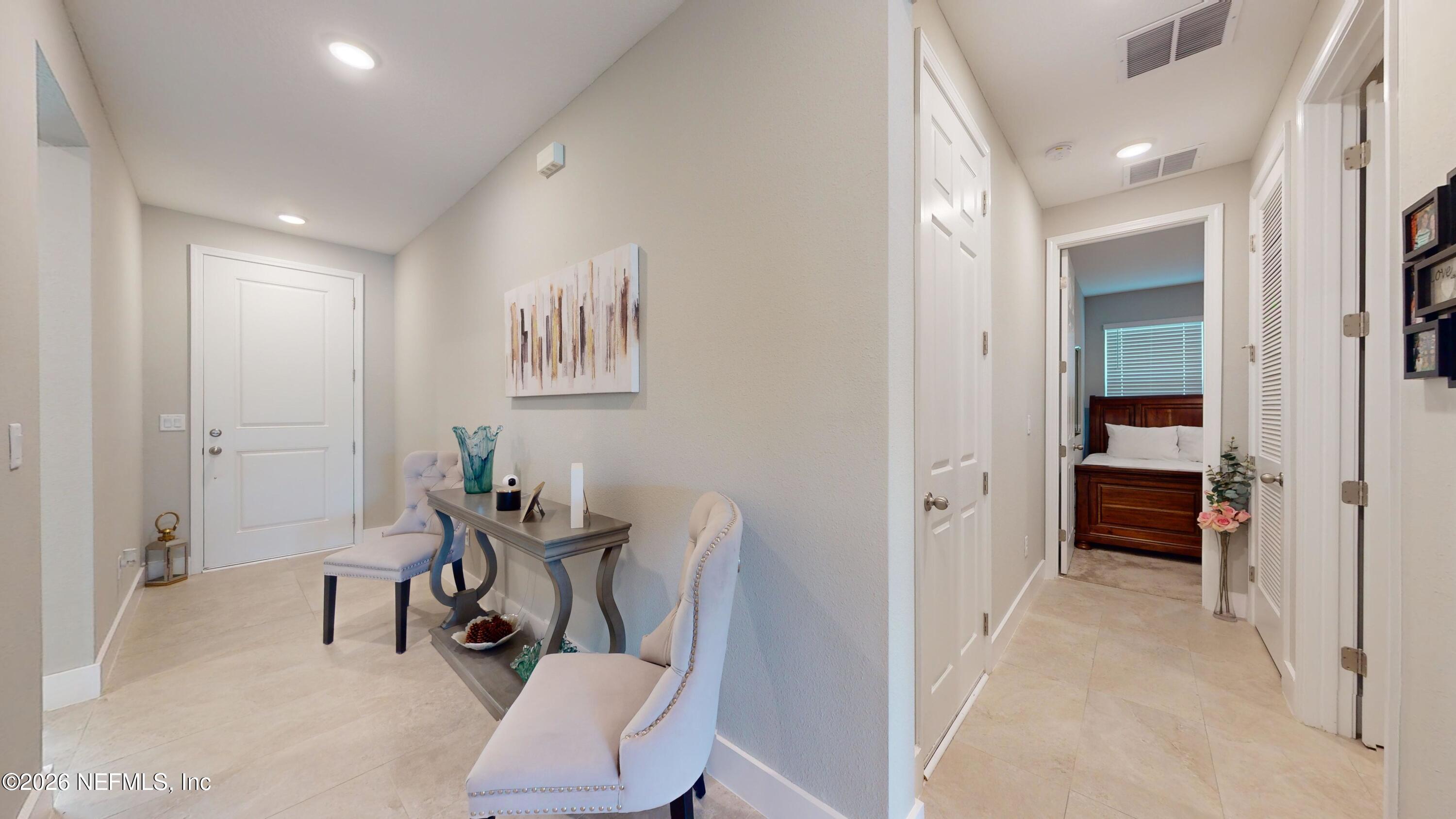 122 Field Flower Way St. Augustine, FL 32092 - Photo 5 of 55 a view of a hallway with furniture and a livingroom view