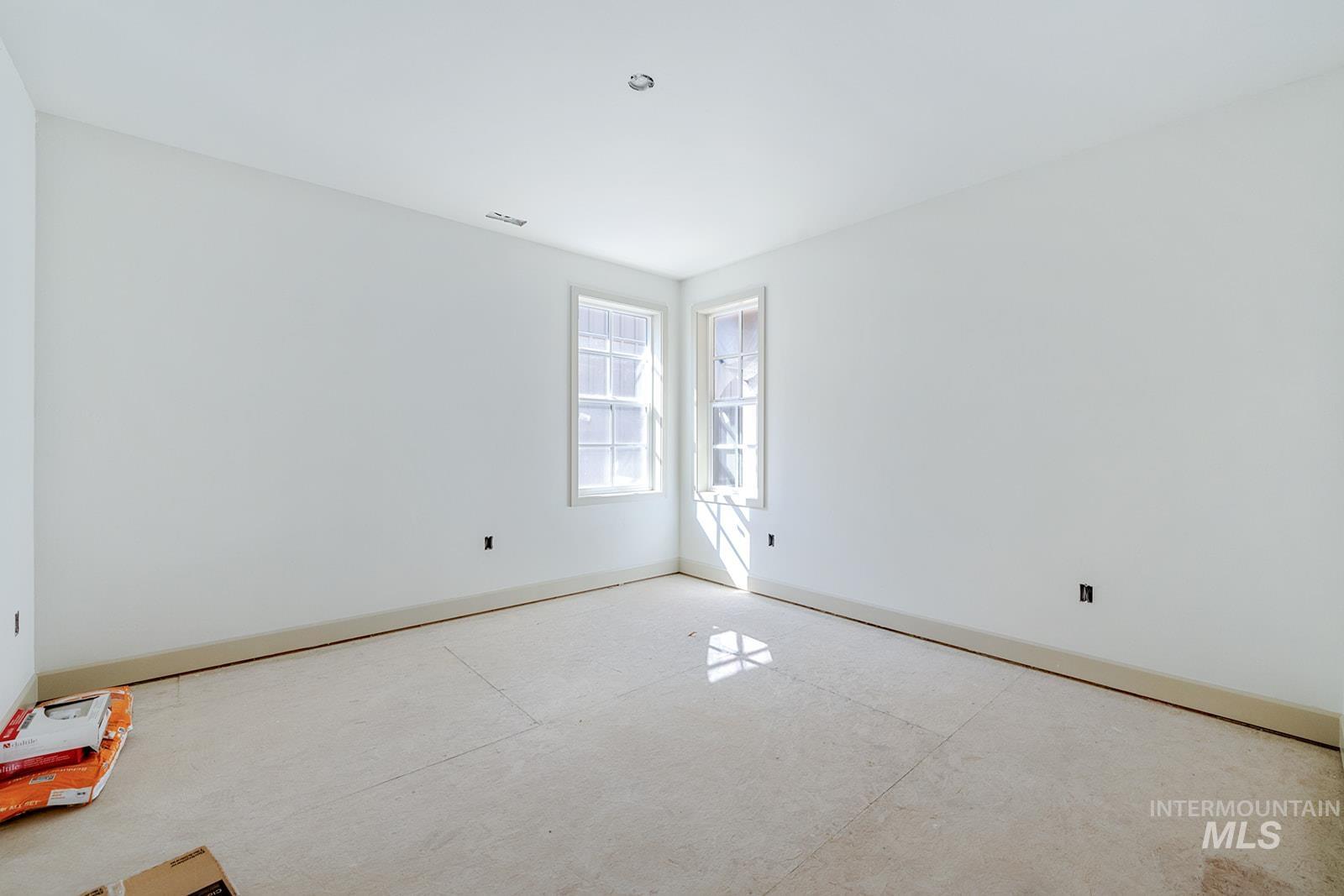 1452 Picotee Circle, Unit ROSE Moscow, ID 83843 - Photo 11 of 19 Spare room featuring baseboards and concrete flooring