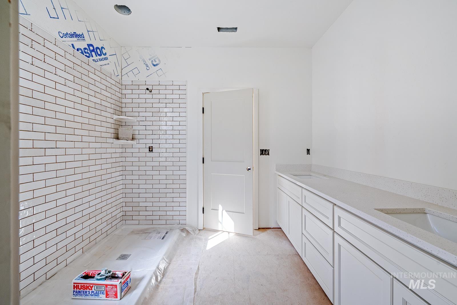1452 Picotee Circle, Unit ROSE Moscow, ID 83843 - Photo 9 of 19 Full bathroom featuring a tile shower and double vanity